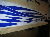 a close up of a blue and white surfboard