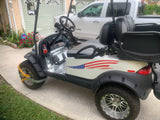 a golf cart with the american flag painted on it