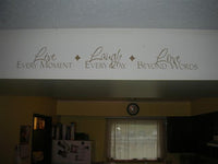 a kitchen with a sign above the stove