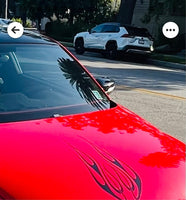 a red car parked on the side of the road