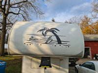 a white trailer with a palm tree painted on it